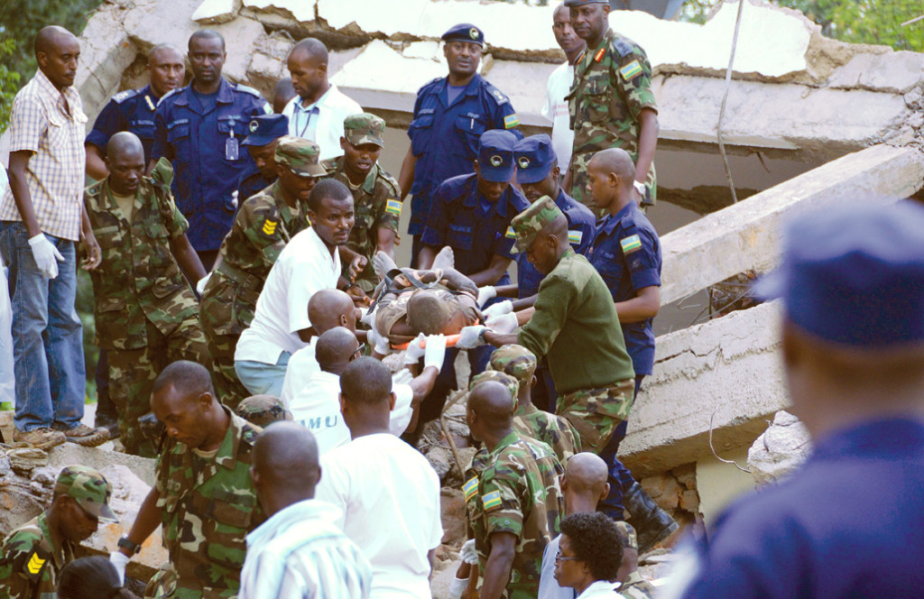 Rwandan police, Army and emergency medical staffers rescue a laborer who was trapped in a collapsed building in Kigali in 2012.