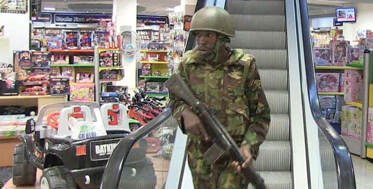 A Kenyan Soldier searches Nairobi’s Westgate Shopping Mall during a violent siege by al-Shabaab militants in September 2013. The 80-hour gun and grenade attack killed nearly 70 people and wounded about 175 others. The image was taken from AFP TV.  [AFP/GETTY IMAGES]