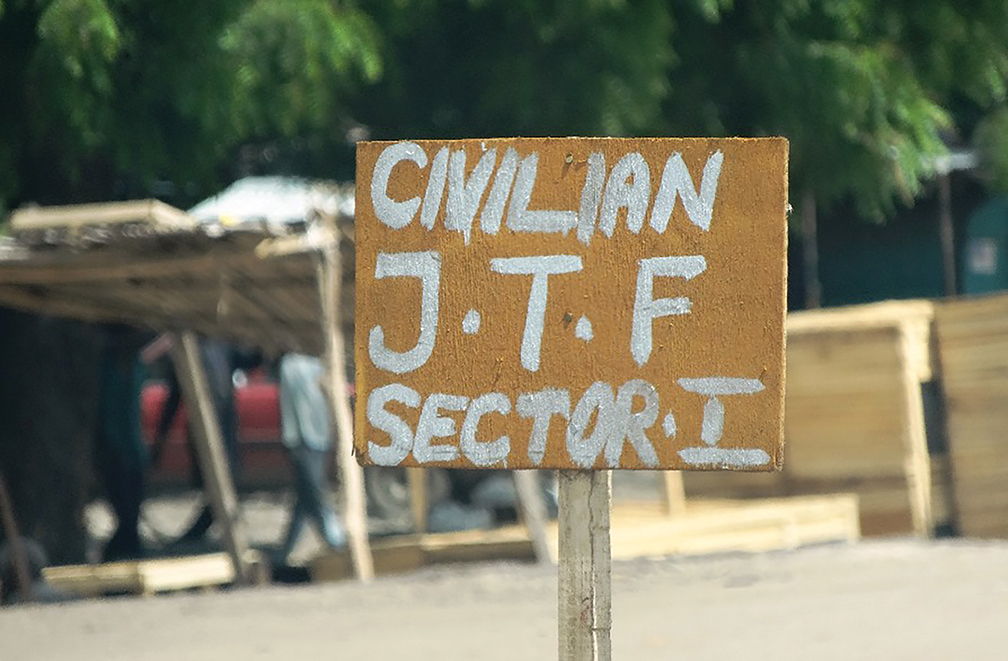 A sign denotes the operating area of the Civilian Joint Task Force in Maiduguri, Nigeria. [AGENCE FRANCE-PRESSE]