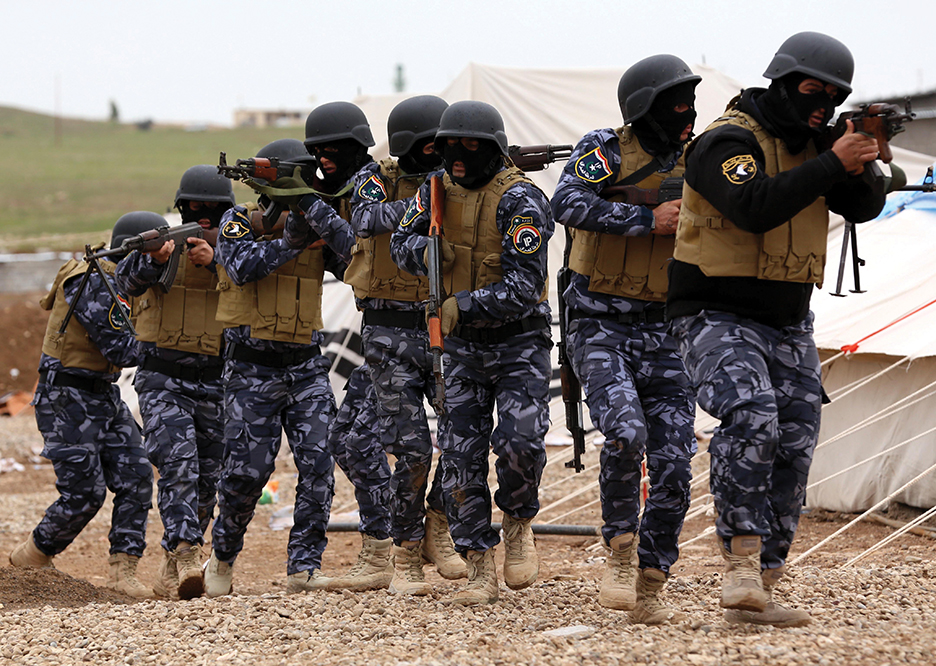 Iraqi troops take part in training camp in preparation for their assault to recapture the northern Iraqi city of Mosul, currently under the control of Islamic State (IS) group fighters, at a camp in the Bardarash district, 30 kilometres northeast of Mosul on January 10, 2015. AFP PHOTO / SAFIN HAMED        (Photo credit should read SAFIN HAMED/AFP/Getty Images)