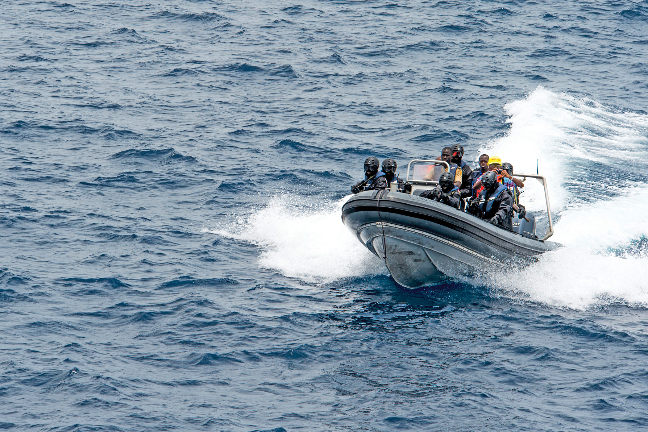 An Ivorian boarding team approaches the FGS Brandenburg during an illegal fishing scenario on March 21 as part of Obangame Express 2015. [petty officer 3RD CLASS LUIS R. CHAVEZ JR./U.S. NAVY ]